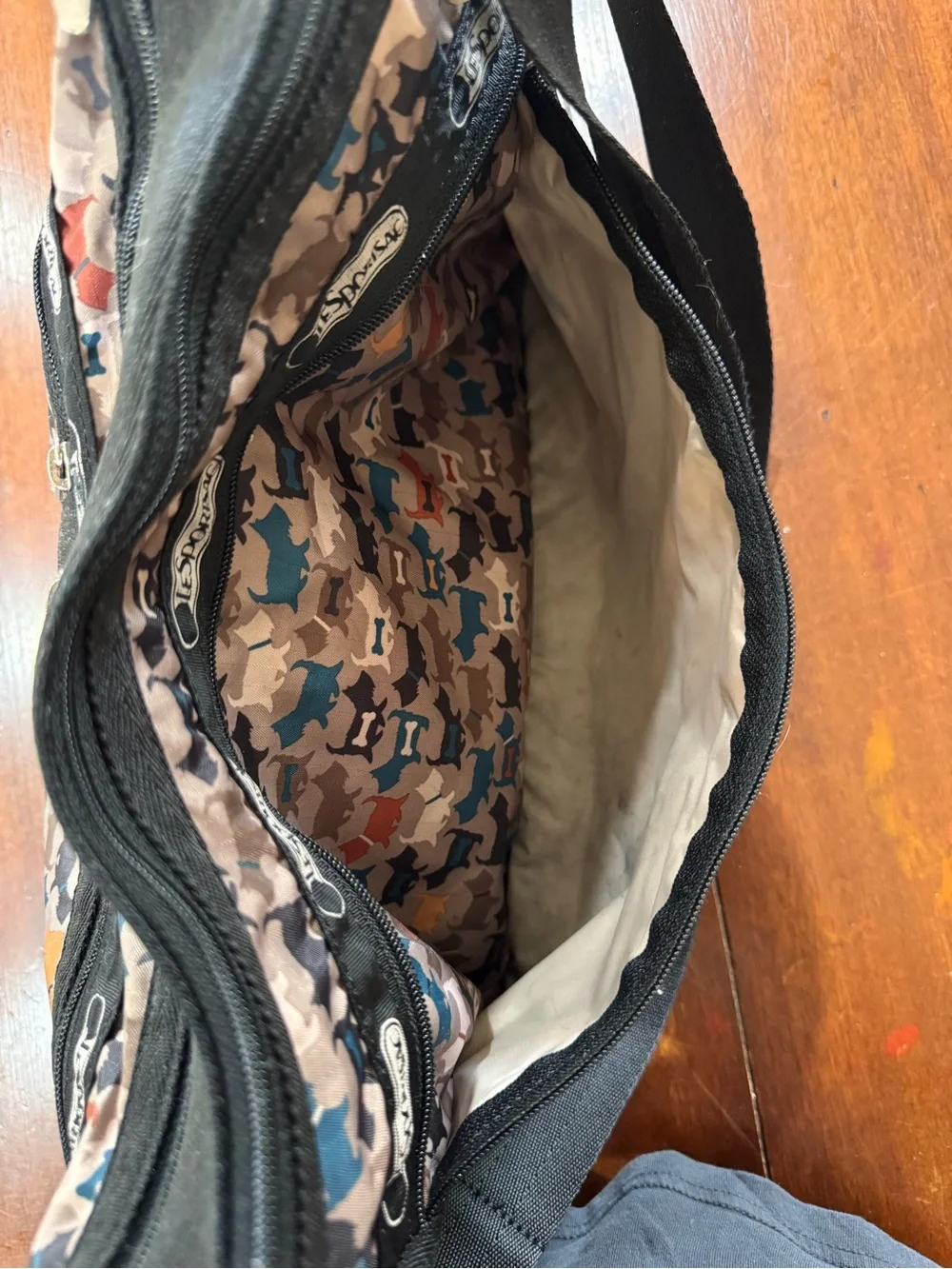LeSportsac Multi-Dog Print Crossbody in Beige, Blue, Black & Red Accents